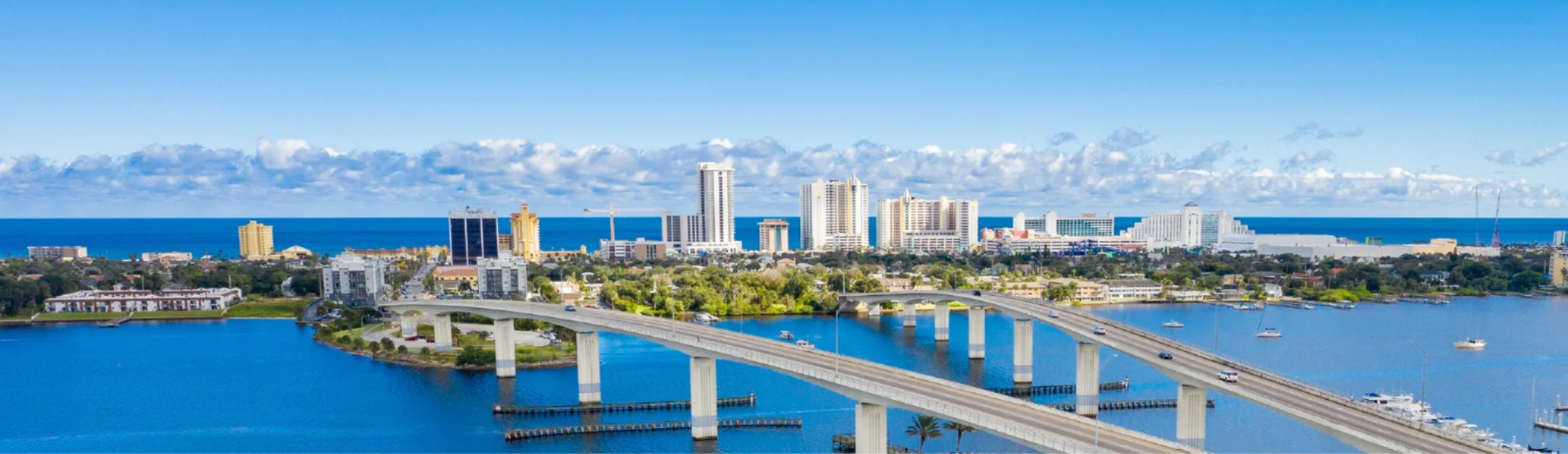 Florida waterfront marina with yachts and palm trees
